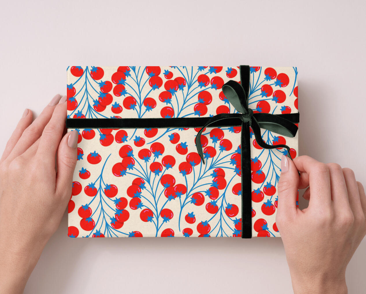 Tiny red tomato pattern on cream colored gift wrap.