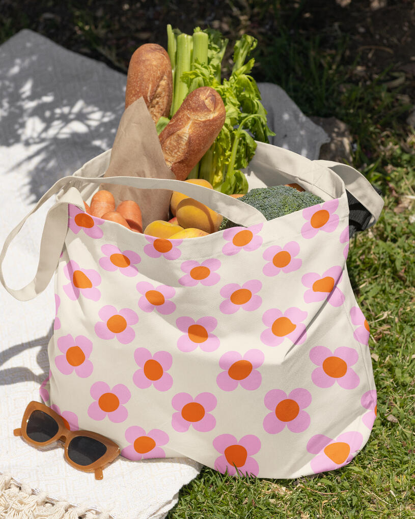 Canvas tote bag with pink and orange retro style flower pattern.