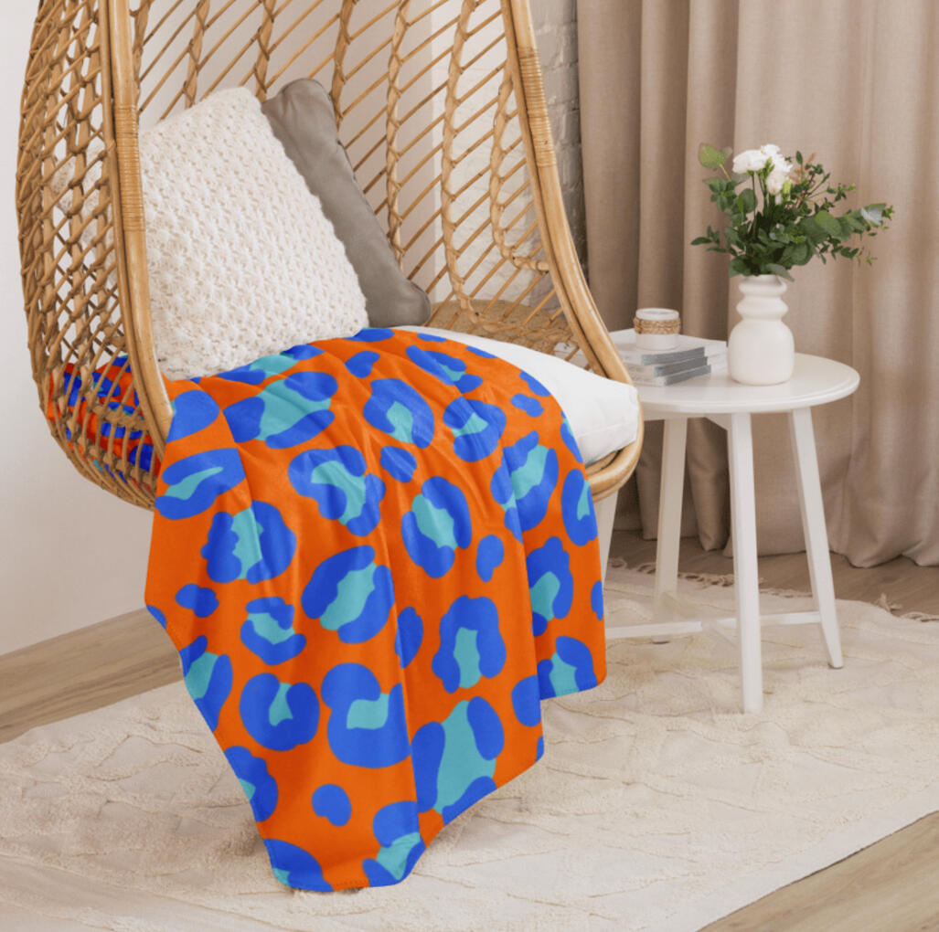 Bold orange and blue leopard print pattern.