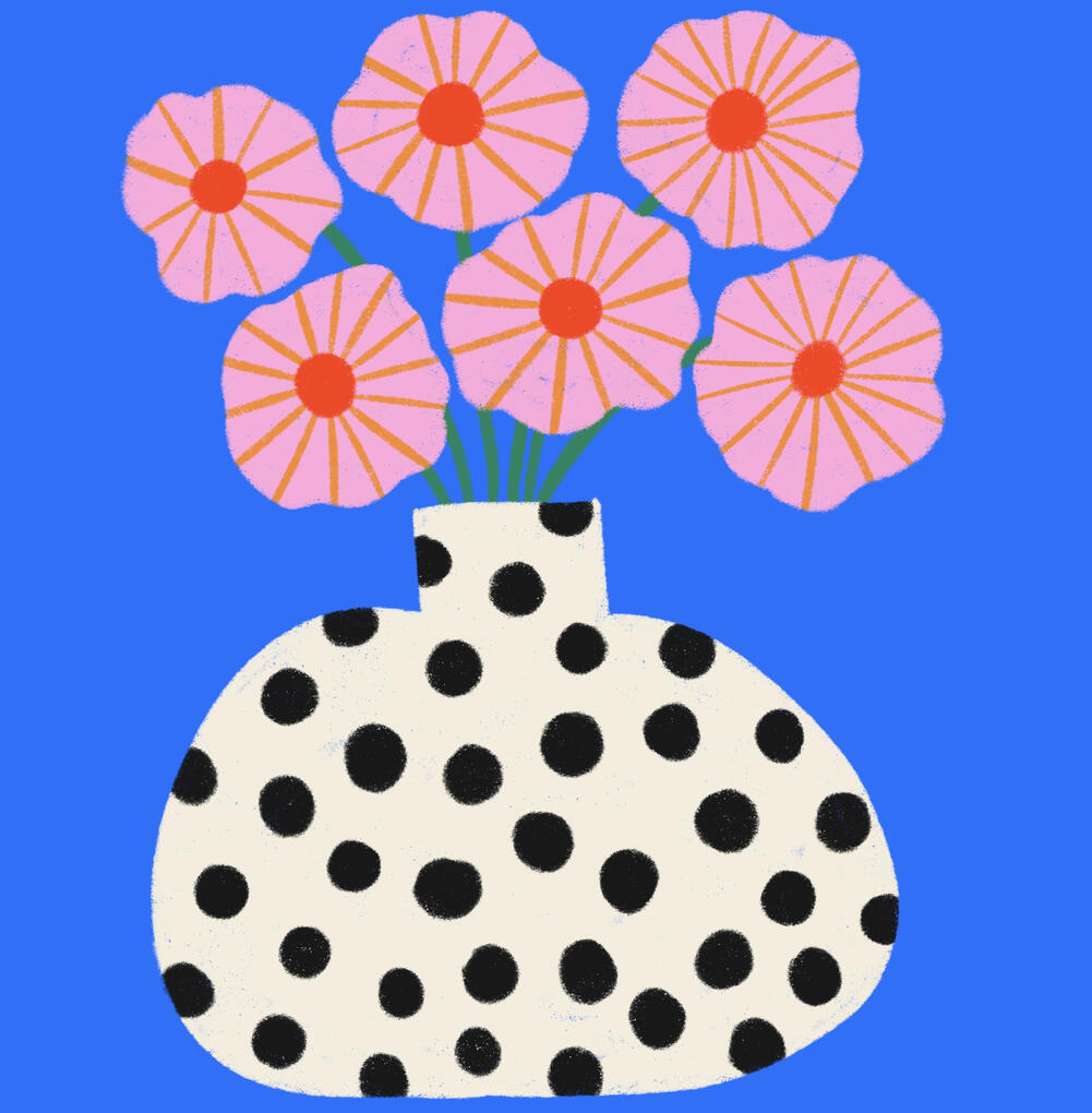 Wavy pink flowers with orange stripes and red middle standing in a cream colored vase with black polka dots on a blue background.